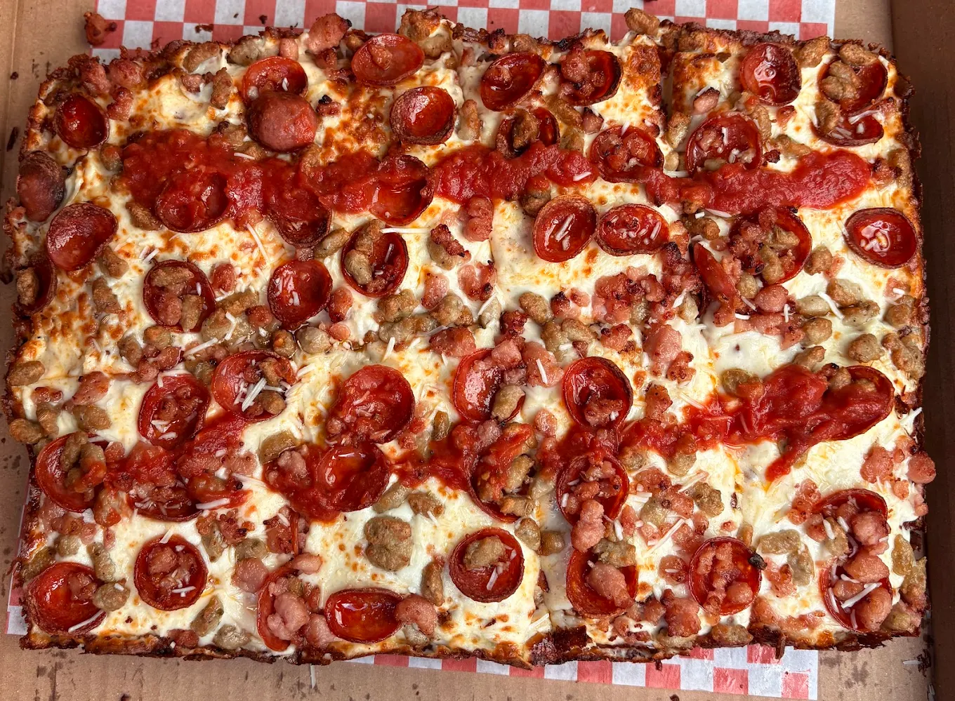 Original Pizza’s Detroit-style pizza loaded with pepperoni, bacon, cheese and tomato sauce