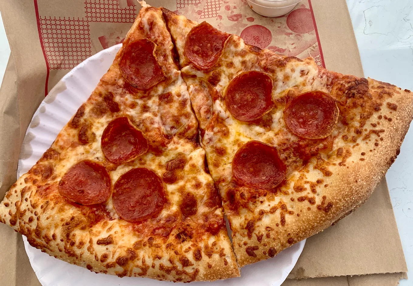 Two generous pepperoni slices fresh from Original Pizza